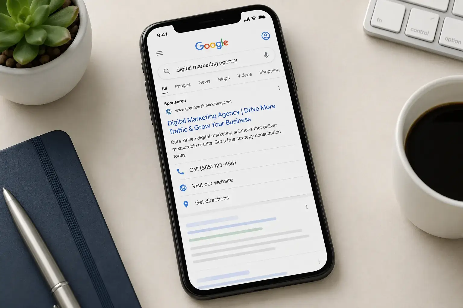 Phone showing a sponsored Google search result for a digital marketing agency